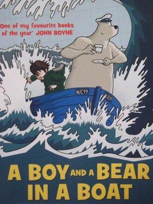 A Boy and a Bear in a Boat