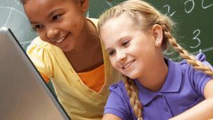 Girls looking at a laptop