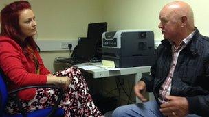 Citizens Advice worker helping patient at GP surgery