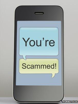 phone with "you're scammed" message