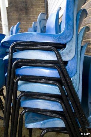 Stacked plastic chairs