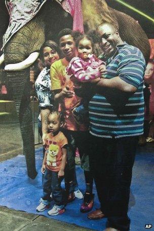 Eric Garner poses with his family on a day out in an undated photo