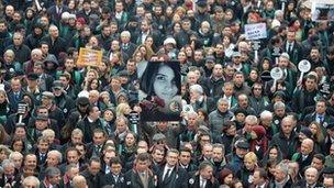 A man holds a poster depicting slain Ozgecan Aslan during a march of members of Turkey's Bar Association in Ankara on 16 February 2015