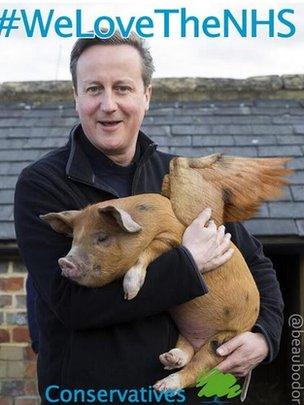 David Cameron holding a flying pig