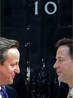 David Cameron and Nick Clegg enter Downing Street in 2010