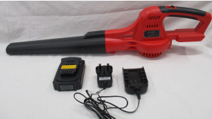 One of the leaf blowers. It has a black nozzle and a red handle and body. Its electrical plug sits in front of it.