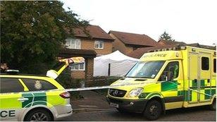 Police vehicles outside the house in Carnegie Gardens