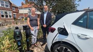 Emily O'Brien and Tom Heagerty, of Connected Kerb, at the new EV charging points in Sutton Road Car Park, Seaford 