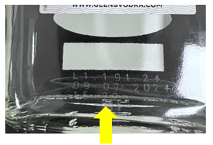 A yellow arrow points to etched numbers on the back of a glass bottle