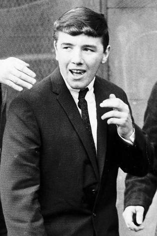 Boyle in 1967, wearing a dark suit and tie and a white shirt