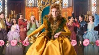 The Queen is posing surrounded by her subjects who are having fun dancing