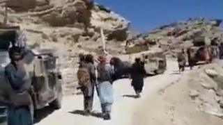 Men thought to be Taliban fighters near the entrance to the Panjshir valley