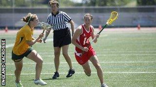 women playing lacrosse