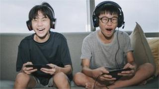 Children playing video games