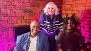 Tolu, healthcare laboratory technician, in The Bitesize Careers Podcast studio standing beside Katie Thistleton and Mark Anderson