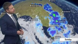 Tomasz Schafernaker stands in front of a weather map of Australia