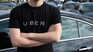 man with crossed arms wearing Uber T shirt