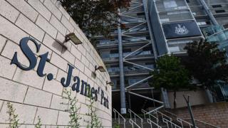 St James' Park in Newcastle. The name of the grounds is on a wall, while the club's logo is displayed on the stadium.