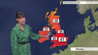 Susan Powell in front of a UK Weather map.