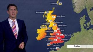 Chris Fawkes standing in front of a UK weather map