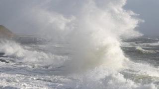 Huge wave crashing near the shore