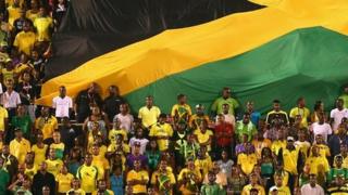 Jamaica fans watch their team play
