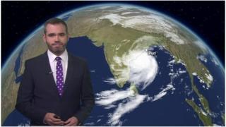 Ben Rich with satellite image of storm