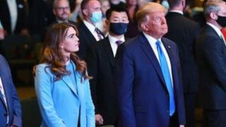 Hope Hicks stands next to former US President Donald Trump