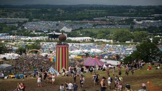 A view from a hill looking down over the Glastonbury site