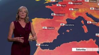 Louise Lear stands in front of a weather map of Europe
