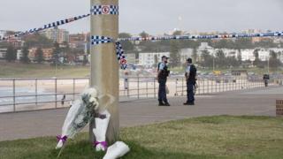 Flowers laid near the scene of the shooting at Bondi Beach in Sydney, Australia.