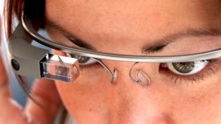 A female attendee tries Google Glass during the Google I/O developer conference on May 17, 2013 in San Francisco, California