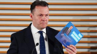 Russell Findlay holding the party's manifesto at the launch.