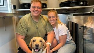 Max and Hannah pose with their dog