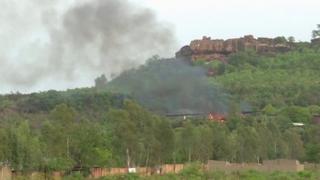 A fire burns in the woods around the resort in Mali