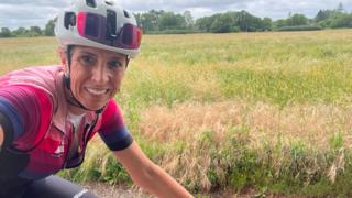 Michelle Sharland riding her bike in countryside