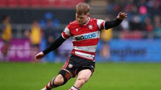 George Barton kicks the ball during a Prem Rugby Cup game for Gloucester this season