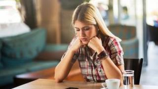 Woman looking at smartphone