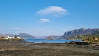 Blue sky over a loch