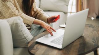 
Woman hands using credit card and laptop for online shopping - stock photo