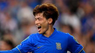 Kyogo Furuhashi in a blue Birmingham City home jersey during a match