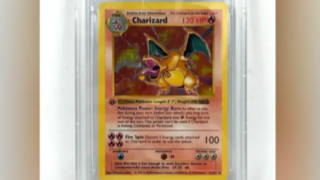 A Charizard Pokemon card with a yellow border