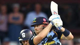Dan Douthwaite swings his bat