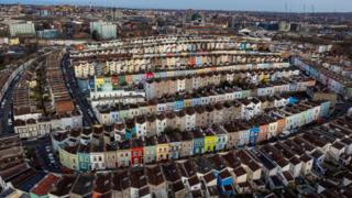 An aerial photo of colourful houses in Totterdown, with other areas of Bristol in the background.