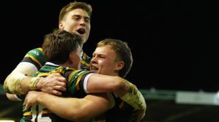 Northampton players celebrate a try