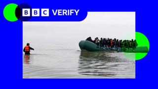 Migrants board a dinghy and prepare to enter the English Channel to sail to the UK from France