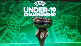 Uefa Under-19 trophy and backdrop