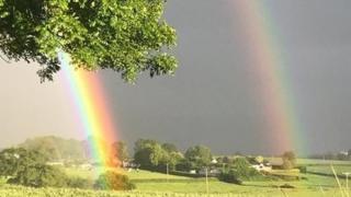 Double rainbow in a field