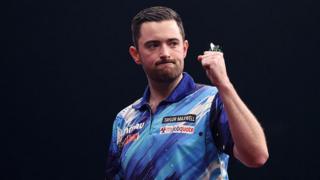 Luke Humphries clenches his fist in celebration