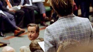 David Cameron looks towards a backbench MP in the Commons during the 2010-2015 Parliament